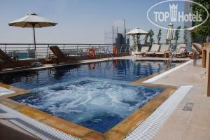 Фотографии отеля  Golden Tulip Suites Dubai 4*