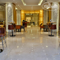 Triumph Luxury Hotel Oasis Cafe