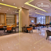 Triumph Luxury Hotel Oasis Cafe