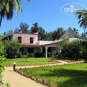 Фотографии отеля  Flame Tree Cottages 