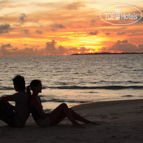 Coco Palm Dhuni Kolhu Couple on the beach sunset
