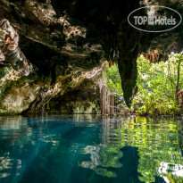 Akumal Natura Glamping swimming in natural cenote Yod