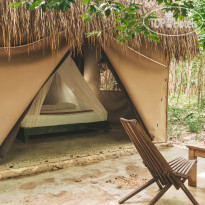 Akumal Natura Glamping king size bed bungalow