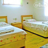 Cirali Hotel Каменный коттедж (спальня)
