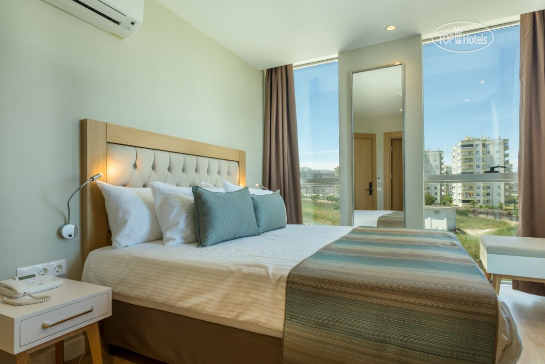 Aska lara resort & spa 5*. Aska lara river suites. Патио сьют в солнечном фото. Aska lara resort & spa 5* ривер. Отель в турции aska lara.